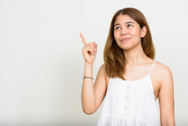 young Asian woman on white