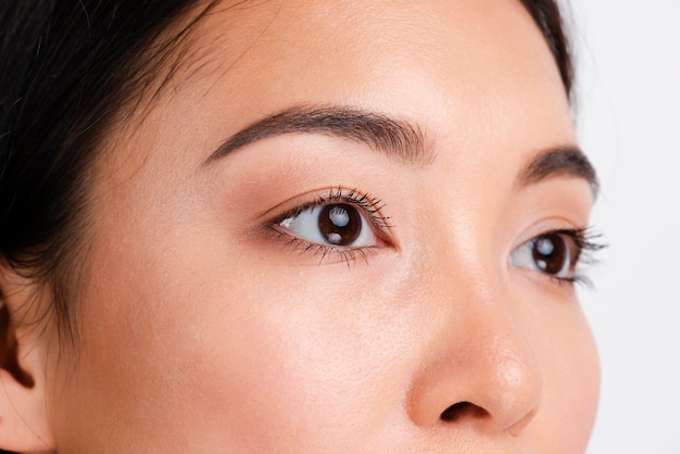 Photo young asian woman with clear skin looking away