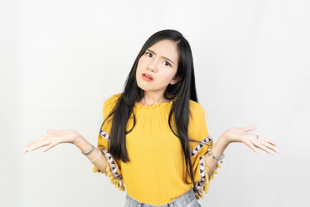 young asian woman with a confused expression