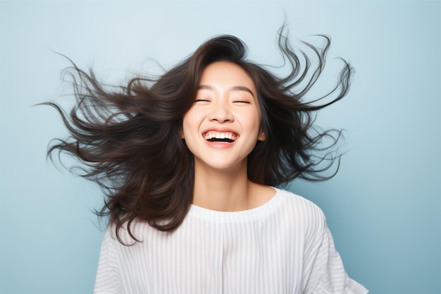 a young asian woman with a happy successful expression