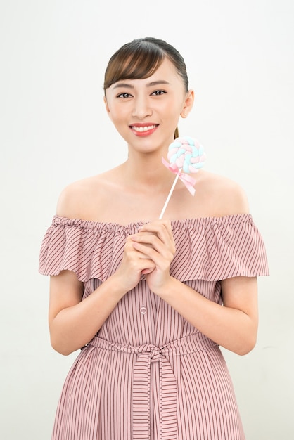 Young asian woman with lolipop