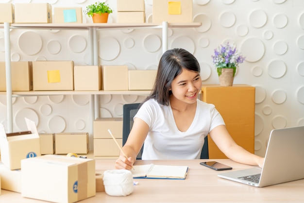 young asian woman working with digital tablet at workplace