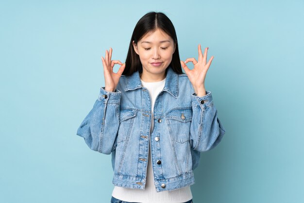 Young asian woman in zen pose