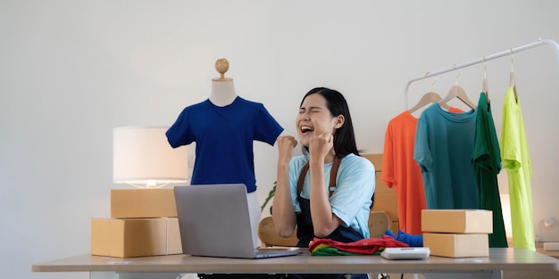 Young asian women happy after new order from customer surprise
and shock face of asian woman success on making big sale of his
online store online selling online shopping