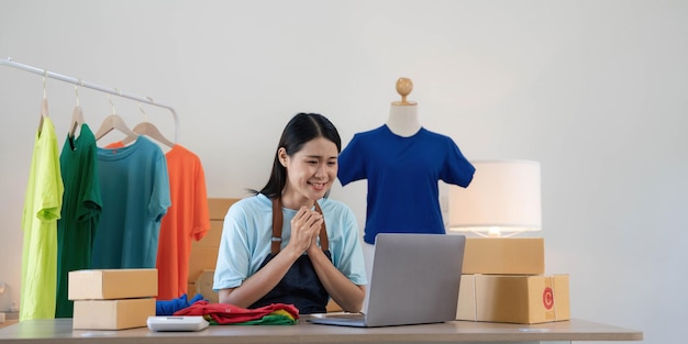 Young asian women happy after new order from customer surprise\
and shock face of asian woman success on making big sale of his\
online store online selling online shopping