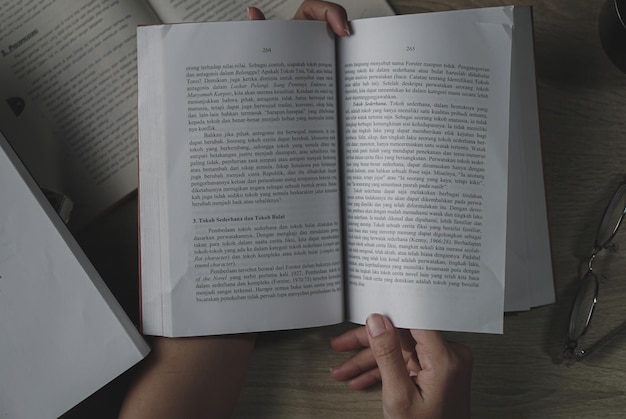 young asian women reading a book