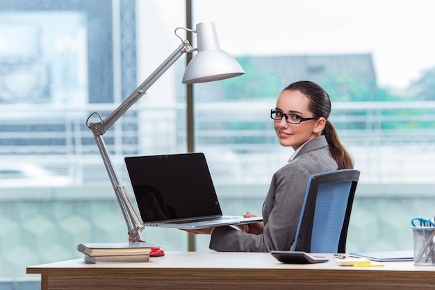 Young assistant working in the office