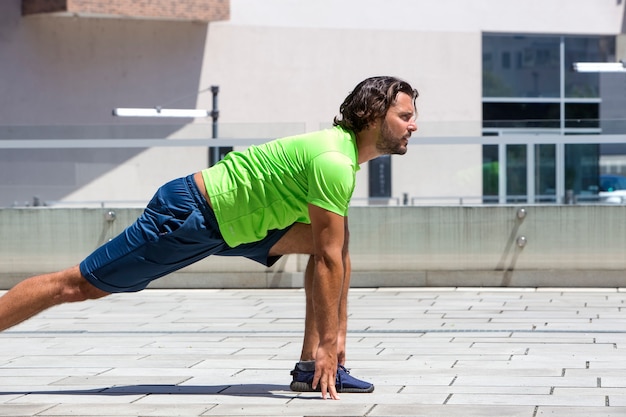 Young athlete doing stretching exercise