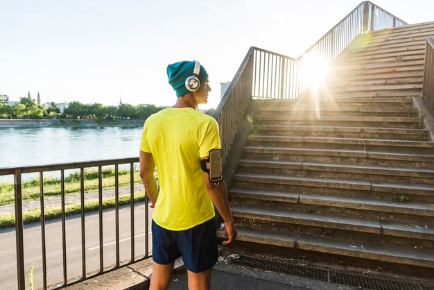 Young athlete jogging up stairs in the city