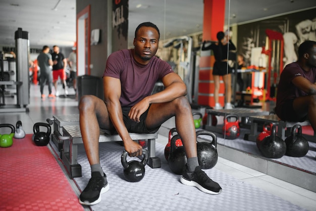 Young athletic African American man in the gym