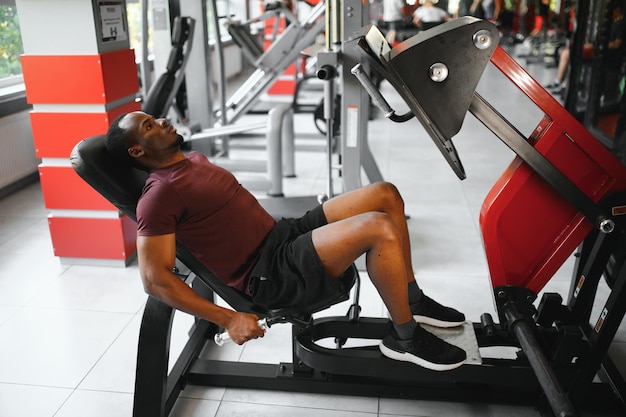 Young athletic African American man in the gym