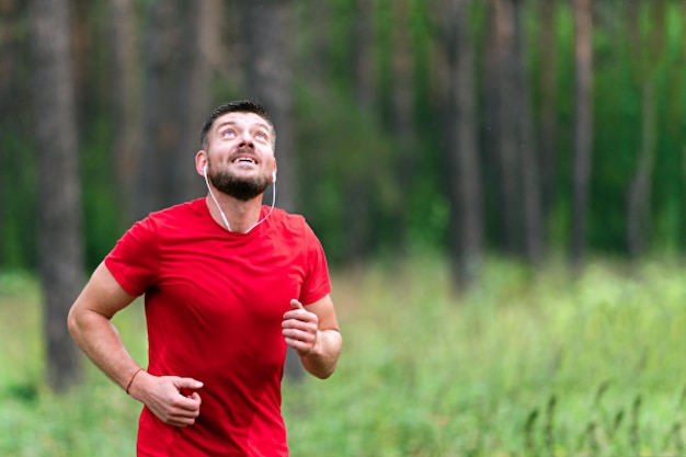 Young athletic man jogging in the park