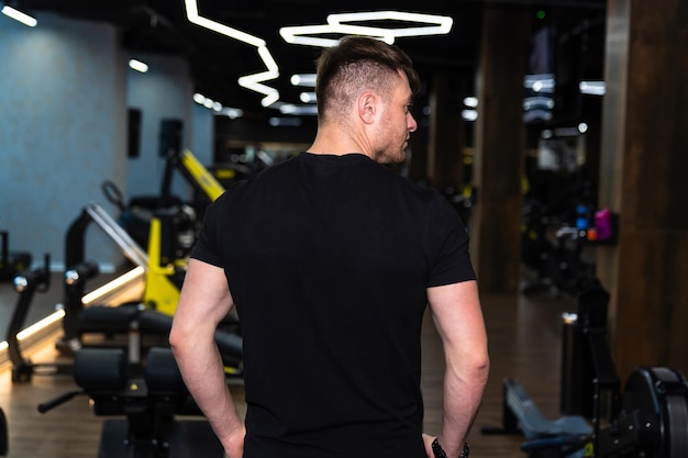 Young athletic sportsman back Back side of handsome strong man