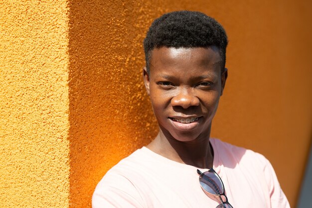 young attractive african male near the wall