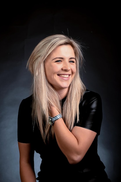 Young attractive blonde woman white race looking at camera and smiling white-toothed smile