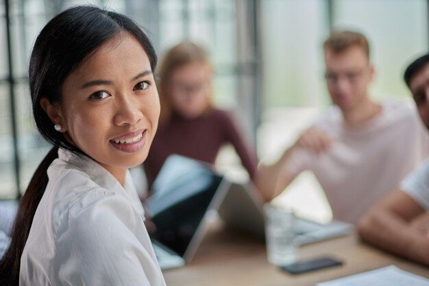 Young attractive business lady looking at the camera while