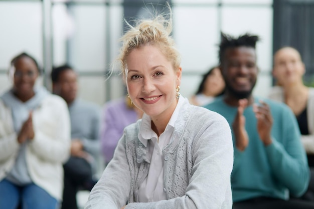 Young attractive business woman teacher or trainermentor looking at the camera