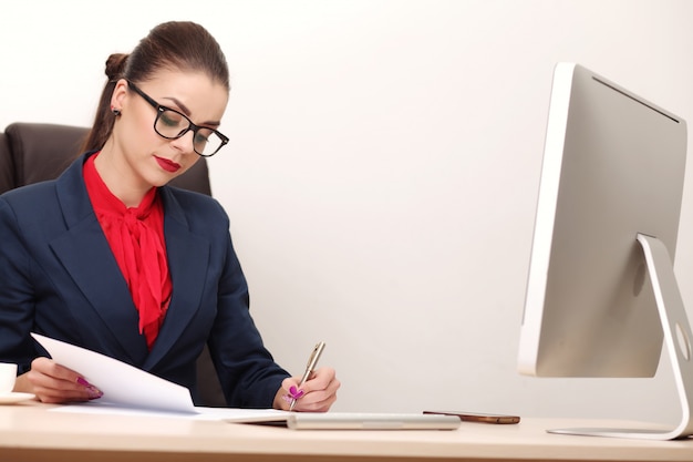 Young and attractive business woman working in office