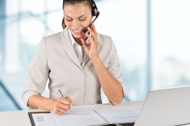 Young attractive businesswoman working with laptop