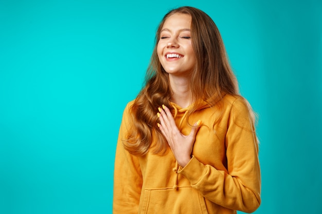 Young attractive cheerful girl laughing with joy
