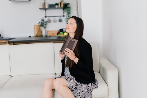 Young attractive european woman to see a smart phone relaxing at home