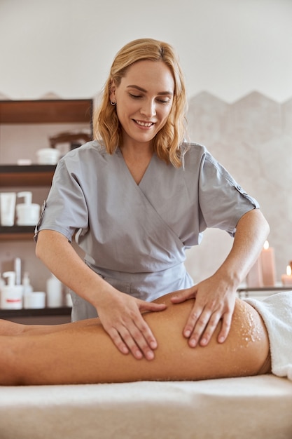 Young attractive female in massage salon is having beauty and healthcare procedures