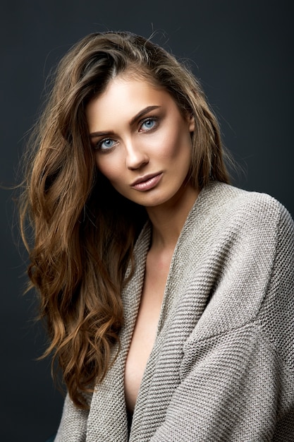 Young attractive female model posing in a studio beauty portrait