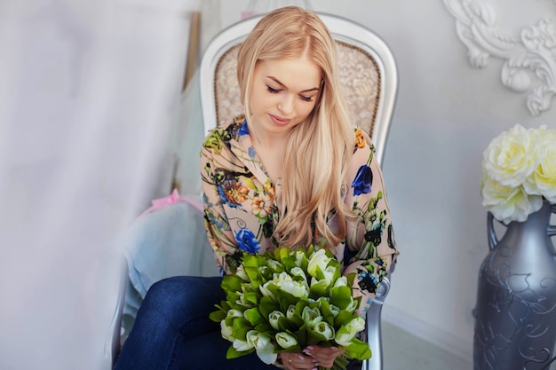 Young attractive girl with flowers. 