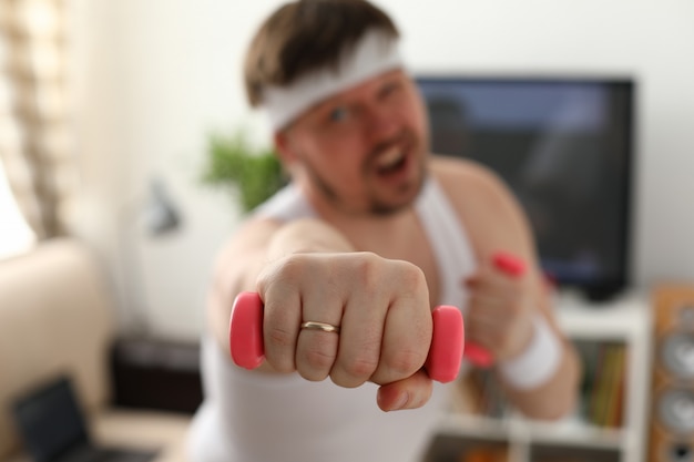 Young attractive man engaged in fitness