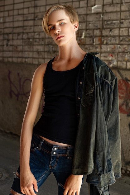 Young attractive man posing on the street