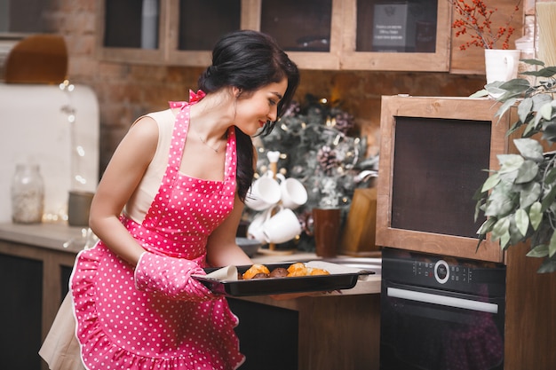 Young attractive woman baking