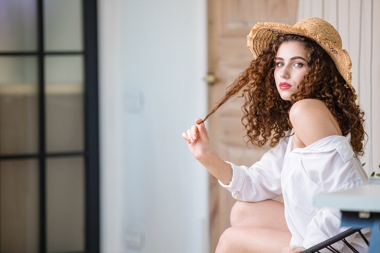 Young attractive woman on balcony in modern loft apartment