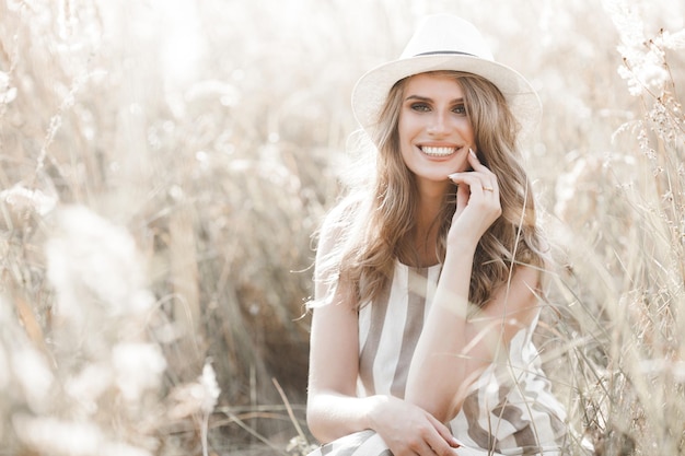 Young attractive woman in the hat Closeup portrait of beautiful woman outdoors Pretty lady smiling