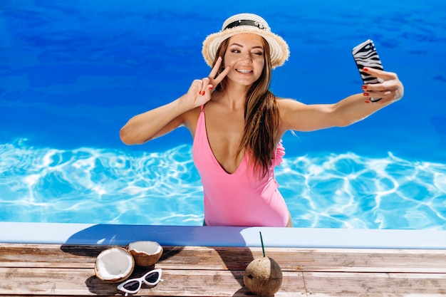 Young attractive woman at the pool