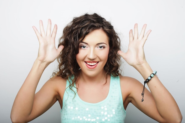 Young attractive woman smile and happy over white background