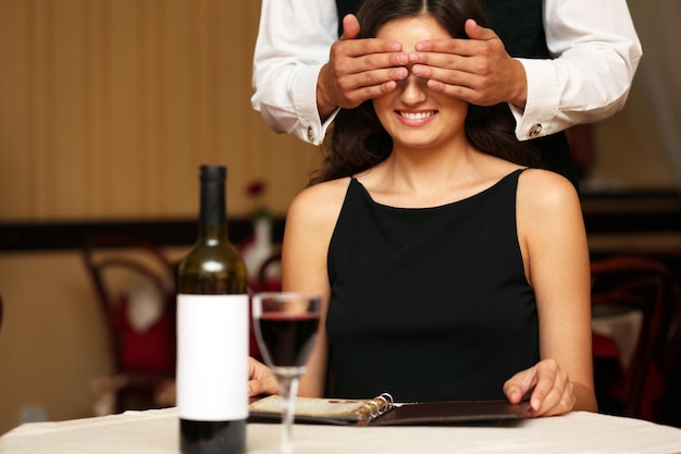 Young attractive woman with closed eyes at the restaurant