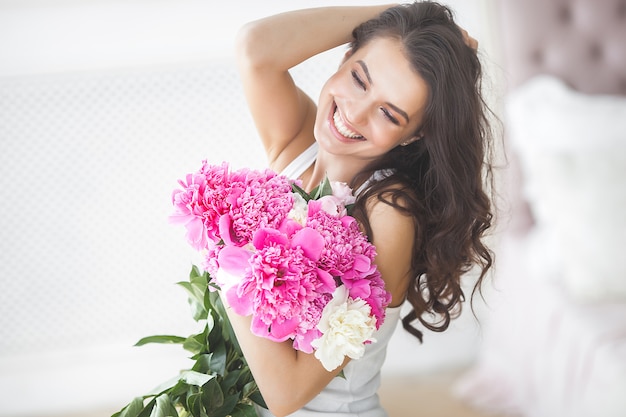 Young attractive woman with flowers