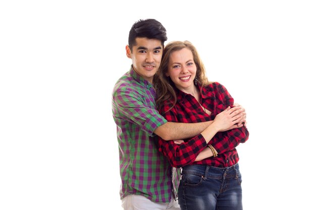 Young attractive woman with long chestnut hair and young smartlooking man in plaid shirts