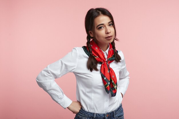 Young attractive Young woman wearing white shirt isolated over pink wall