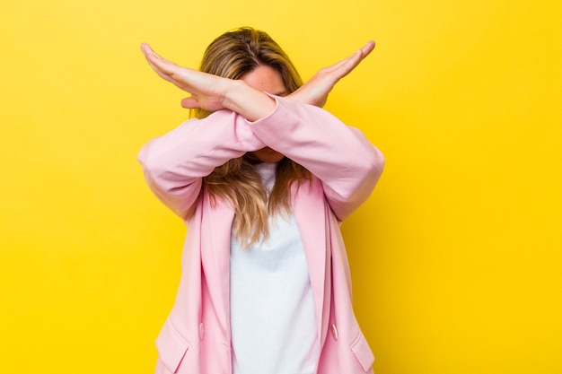 Young australian woman isolated keeping two arms crossed, denial concept.