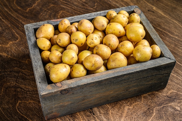 Young baby Potatoes in a wooden box