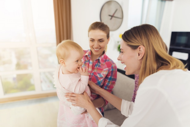 Young babysitter meets the mother of the children 