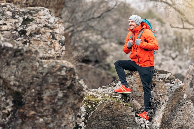 Young Backpacker enjoying of Nature. Mountaineer Concept.