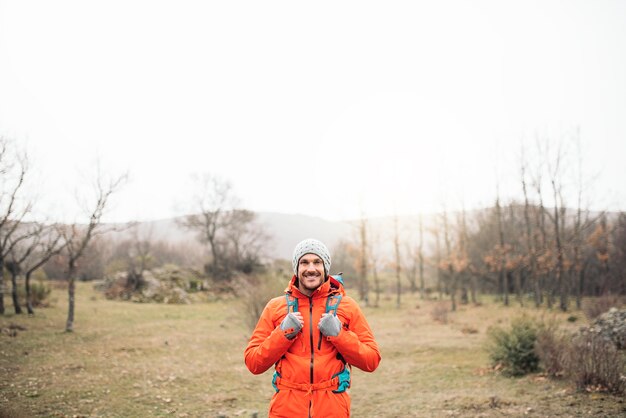 Young Backpacker enjoying of Nature. Mountaineer Concept.