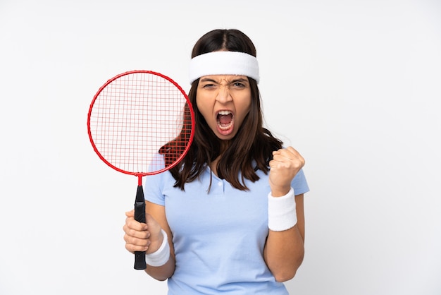 Young badminton player woman over isolated white background frustrated by a bad situation