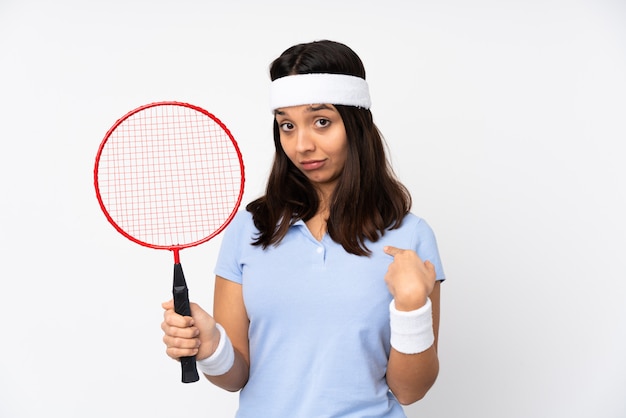 Young badminton player woman over isolated white wall proud and self-satisfied