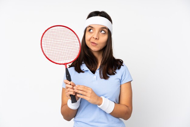 Young badminton player woman isolated