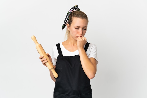 Young bakery woman isolated on white