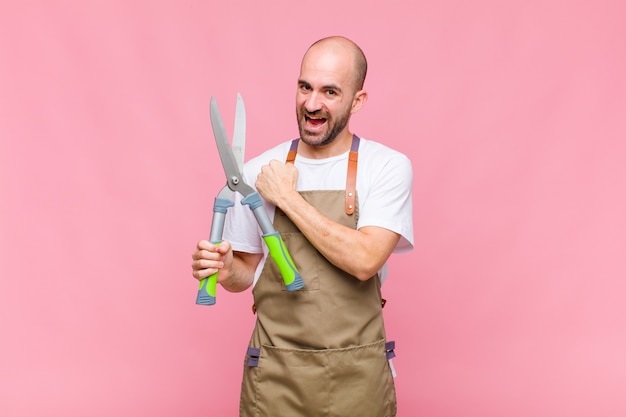 Young bald man feeling happy