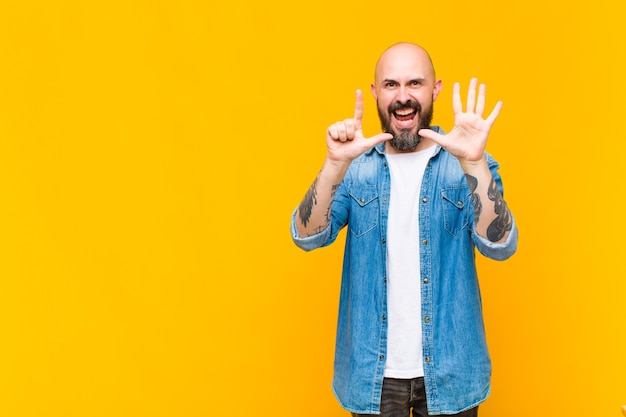 young bald man model expressing a concept 